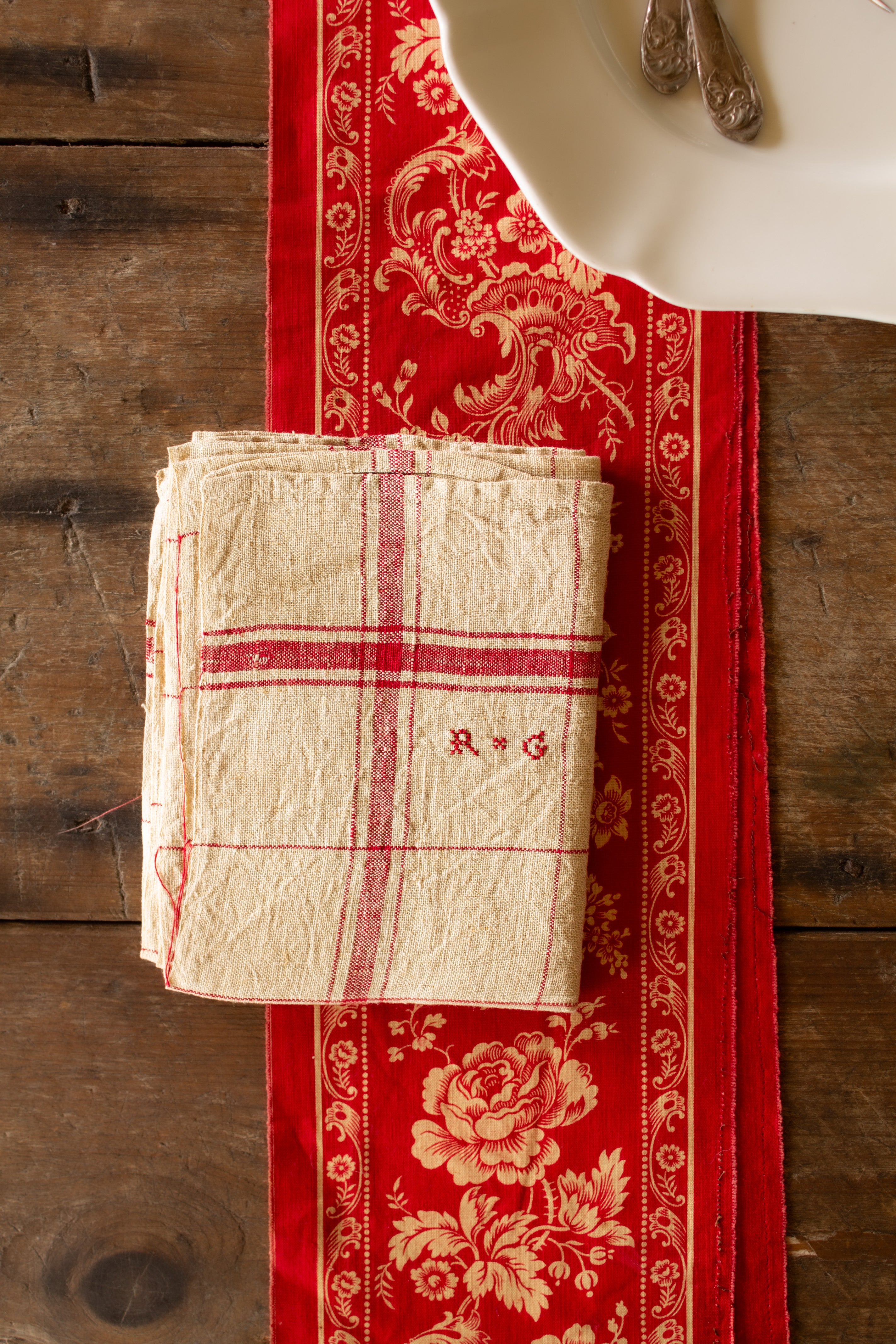 Antique French red check monogrammed torchon dish towel with R G initials from the collection of Dr. June K. Laval.