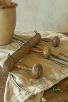 Antique French faux bamboo three peg wooden coat rack with turned pegs and old metal hanging hardware.
