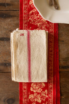 Antique French JM monogrammed red stripe linen torchon sourced in the French provinces with cream linen ground and one hanging loop.