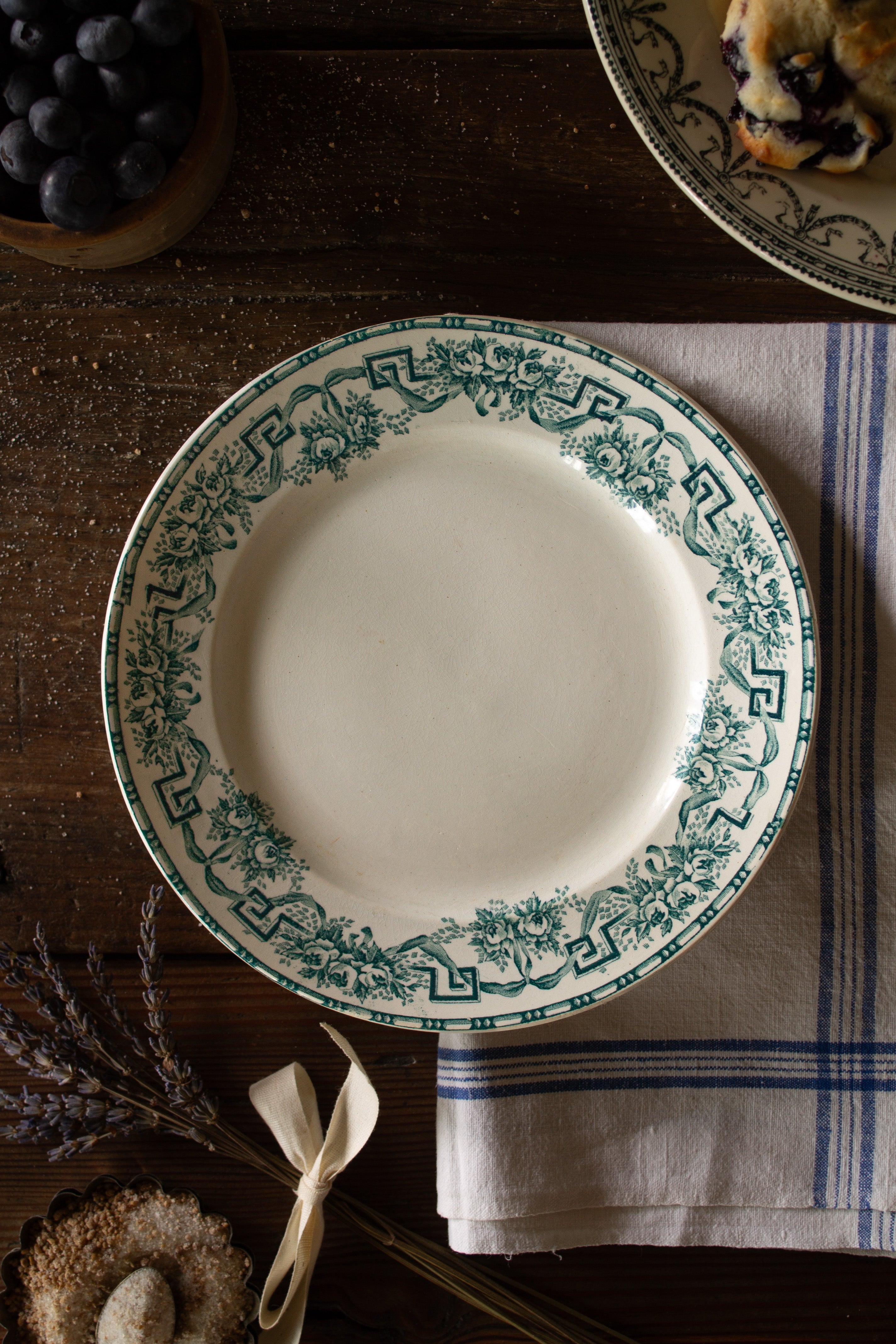 Antique French Moulin des Loups Athènes plate with green floral, ribbon, and Greek-key transferware decoration on a warm cream ground.