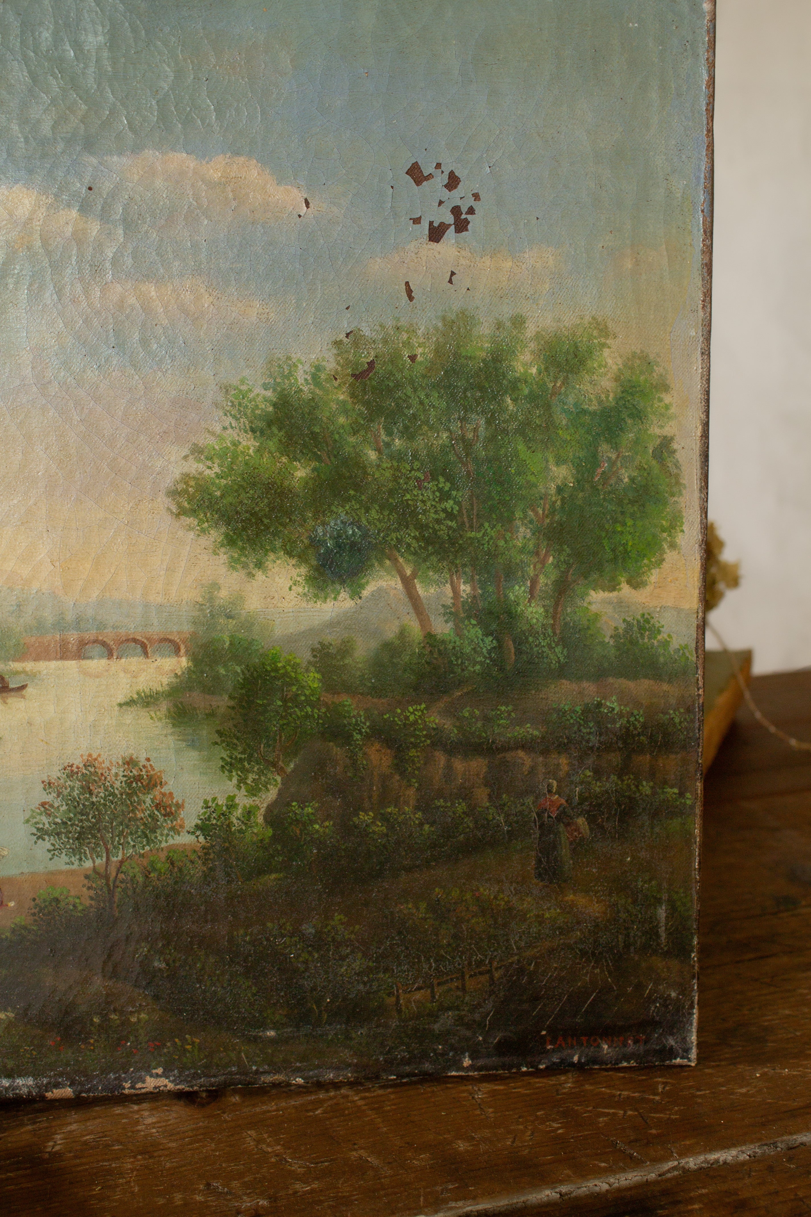 Antique French Romanticism landscape oil painting signed Lantonnet, featuring a riverside scene with figures, boats, trees, and distant hills.