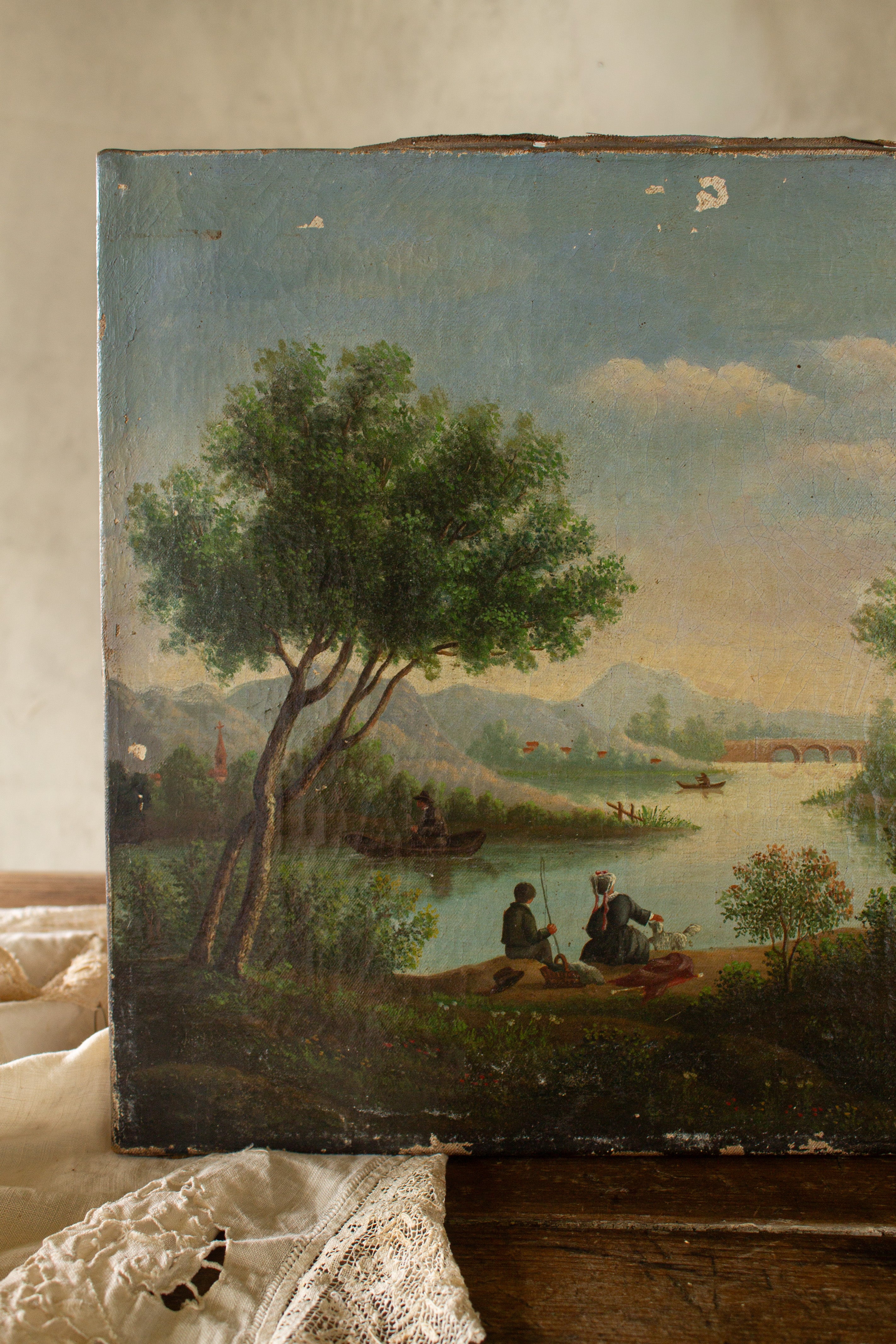 Antique French Romanticism landscape oil painting signed Lantonnet, featuring a riverside scene with figures, boats, trees, and distant hills.