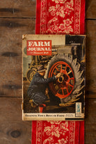 Vintage February 1943 Farm Journal and Farmer’s Wife wartime farm magazine with illustrated tractor cover and Buy War Bonds and Stamps notice.