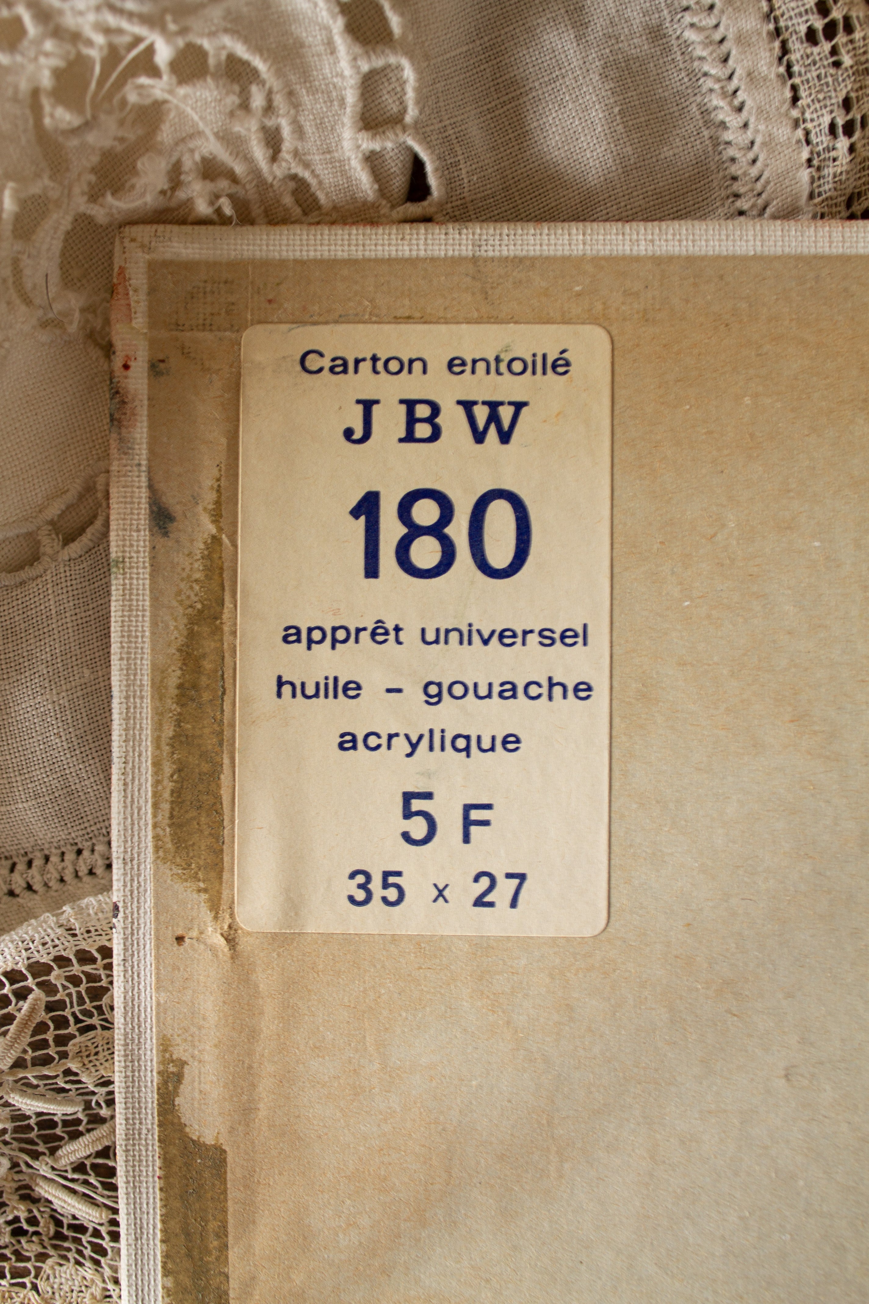 Back of vintage French canvas board painting with original carton entoilé label marked huile, gouache, acrylique, 35 x 27 cm.