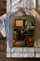 Vintage set of three Time-Life American Country books including Folk Art, The Country Home, and Country Furniture styled on blue and white linen, featuring primitive country, Americana, folk art, pottery, early American furniture, and country interior design reference.