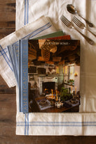 Vintage set of three Time-Life American Country books including Folk Art, The Country Home, and Country Furniture styled on blue and white linen, featuring primitive country, Americana, folk art, pottery, early American furniture, and country interior design reference.